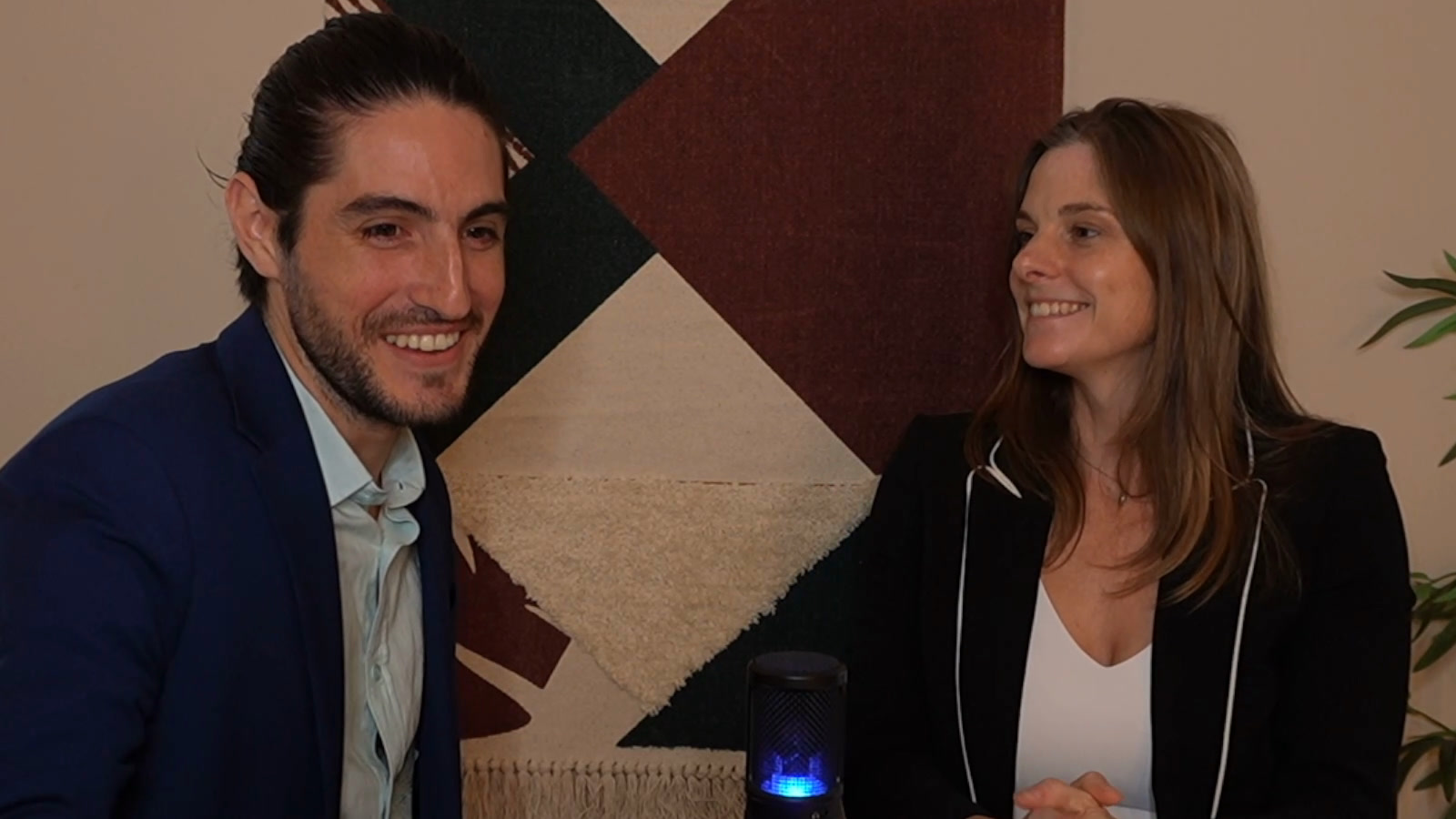 Alejo and Paige Pijuan at the table during the live recording